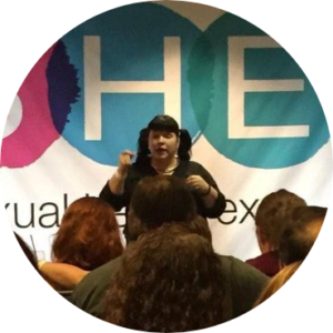 Ducky in front of an audience at the Sexual Health Expo