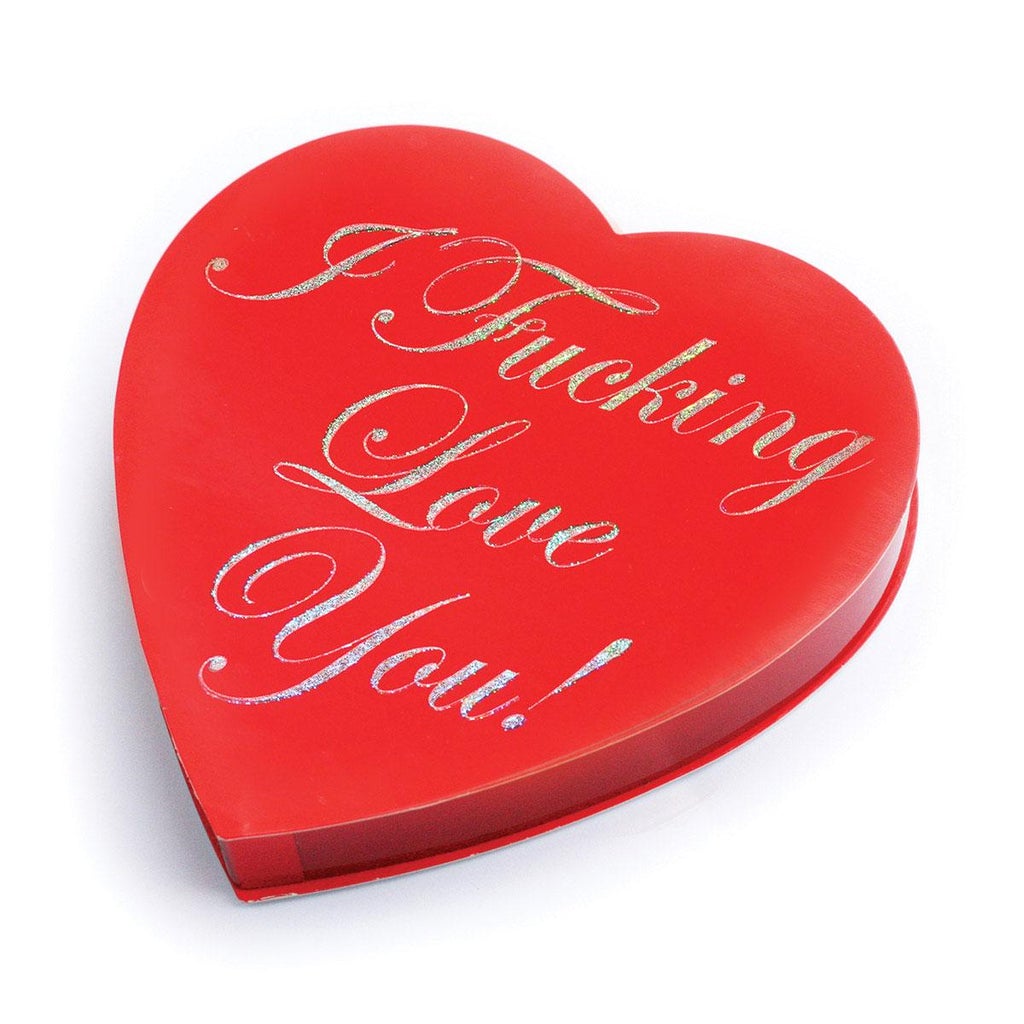 Heart shaped box of chocolates with the words "I Fucking Love You" printed in script on the top.